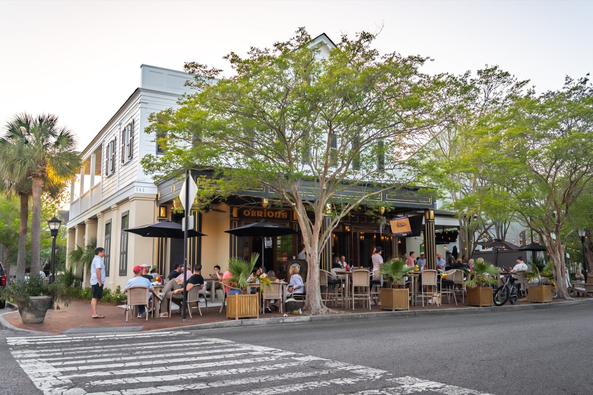 Outdoor Patio Dining at O'Brion's Pub & Grille — Evenings in Mount Pleasant SC Guests dining on the outdoor patio at O'Brion's Pub & Grille in Mount Pleasant SC during golden hour evening