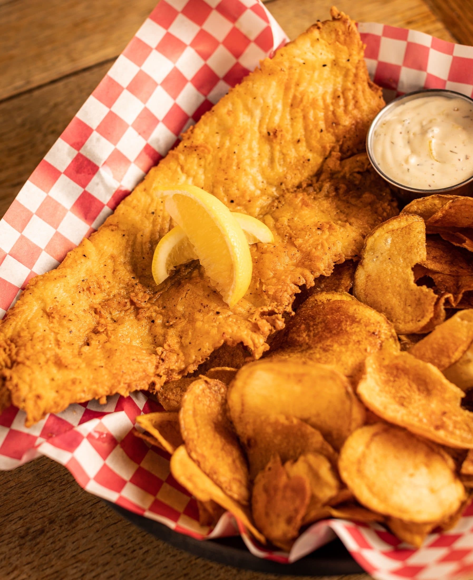 Fish & Chips at O'Brion's Pub & Grille — Beer-Battered Flounder, Mount Pleasant SC Beer-battered fish and chips with hand-sliced potato chips at O'Brion's Pub & Grille Mount Pleasant SC
