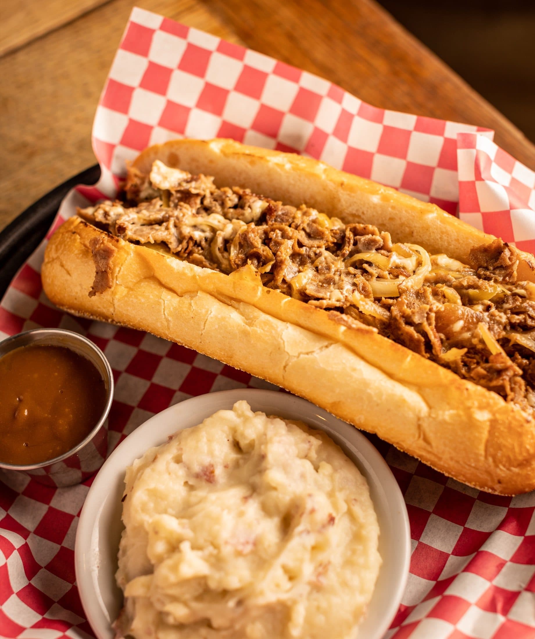 Classic Philly cheesesteak with shaved ribeye and melted American cheese on an Amoroso roll at O'Brion's Pub & Grille